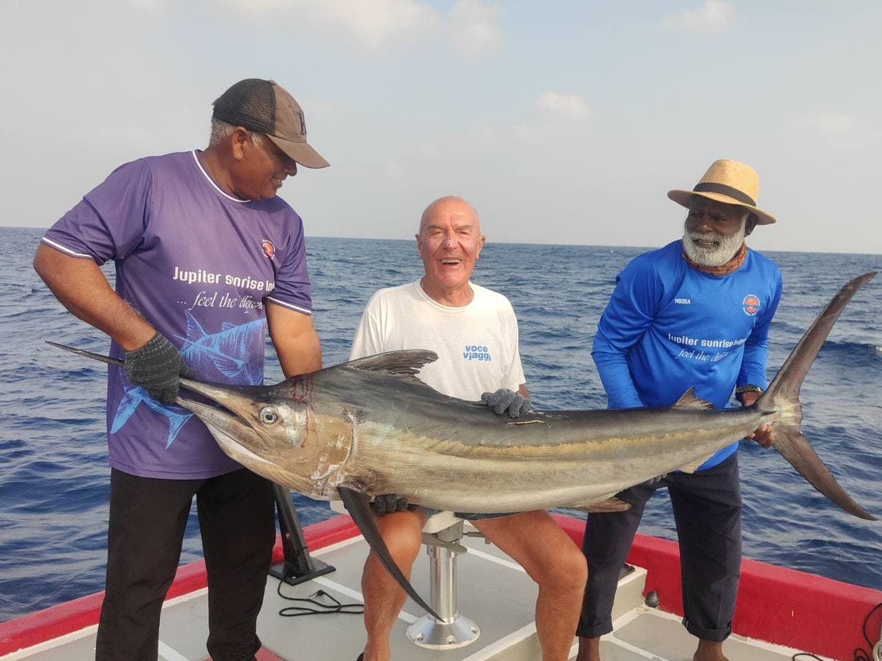 Guests with an offshore catch on deck